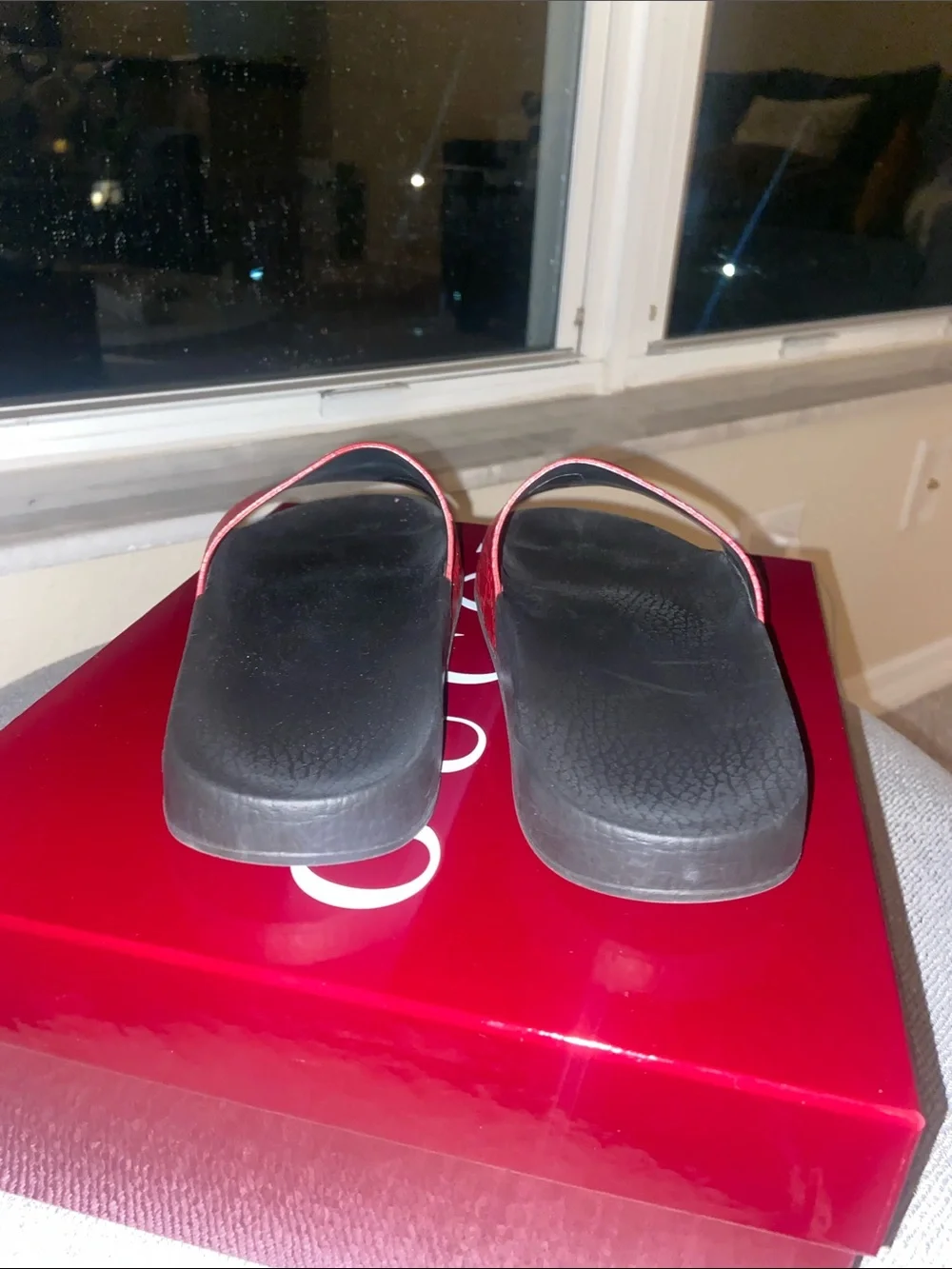 Gucci Red Embossed Logo Slide Sandals with Black Footbed